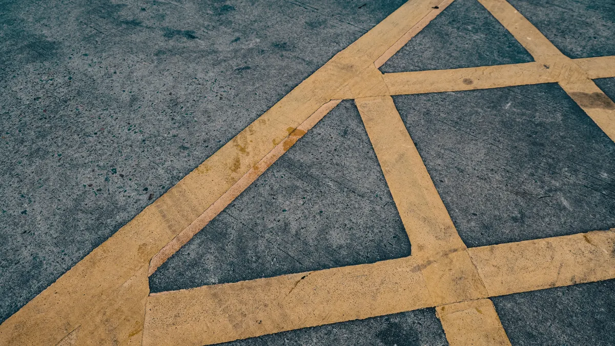 How to Mark Utility Lines Before Digging a Trench Yellow ground markings on pavement